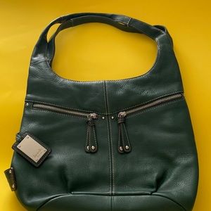 Hunter green Tignonello 9” H x 13” W x 6” deep at bottom. nwot purse